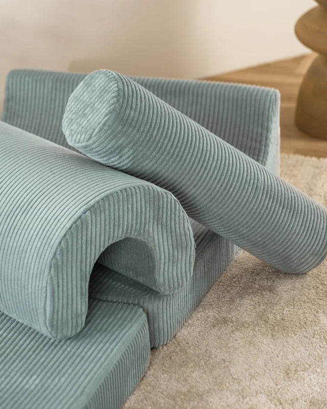 Sofá Infantil Modular de Pana Verde con acabado verde en ambiente de estilo nórdico